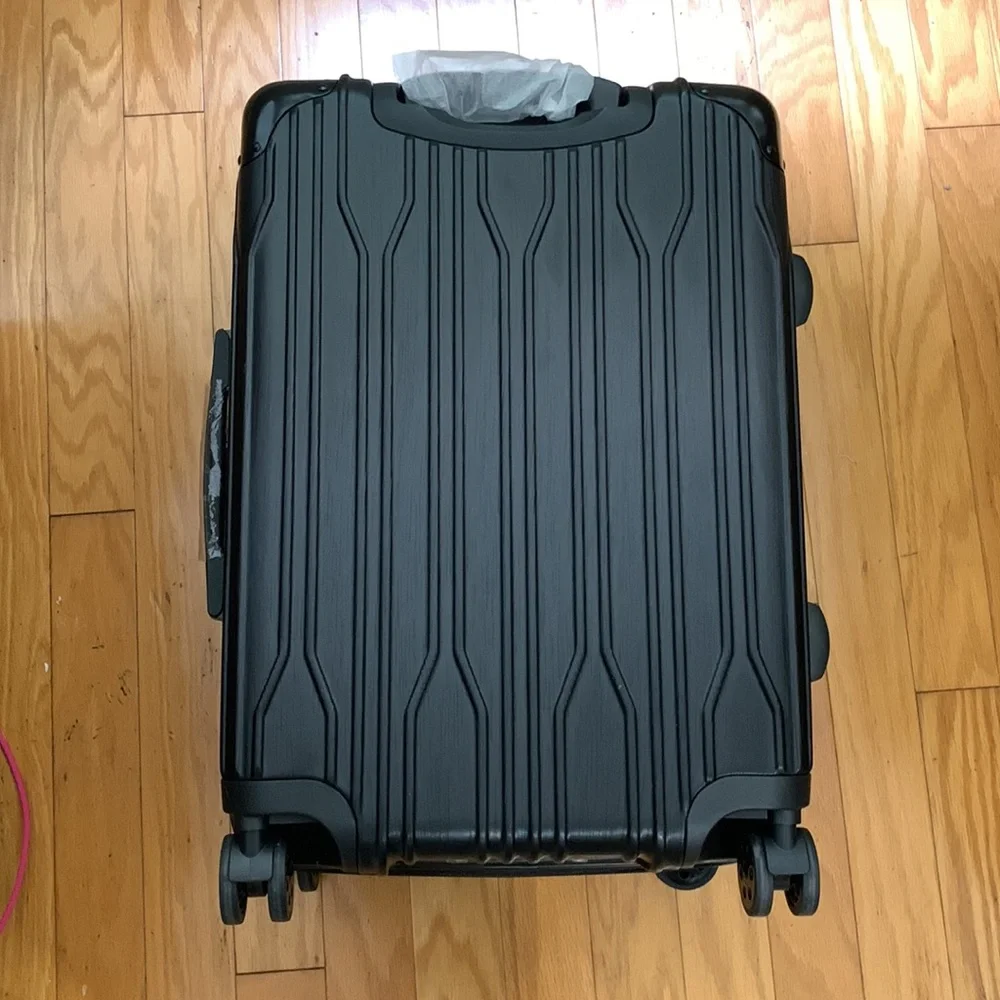 Traveler’s Choice Black Hard-case 24” Suitcase